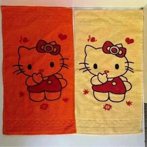 Set of two Hello Kitty hand towels in retro orange  and yellow